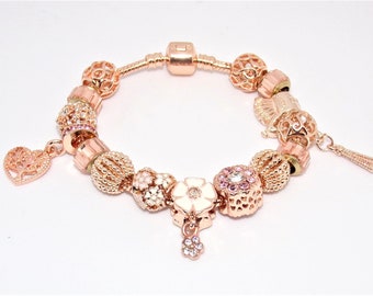 Bracelet  avec des charms "or rose" de style Pandora