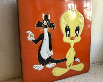 Vintage enameled orange trivet decorated with Tweety and Sylvester, enameled ceramic handmade in France in the 1960's RefA7