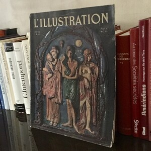 May include: A vintage magazine cover featuring a dark blue background with the title "L'ILLUSTRATION" in white lettering. The cover depicts a relief sculpture of four figures in a forest setting. The figures are carved in a light brown color and appear to be women. The magazine cover is dated "NOEL 1941" and has a price of "40 Fr."
