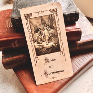 Rzadki antyczny pobożny obraz z Francji „Noël et l'Eucharistie” (Boże Narodzenie i Eucharystia) opublikowany przez Bouasse Jeune około 1920 r.
