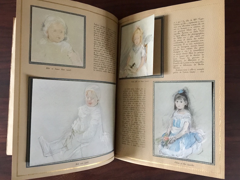 May include: A vintage book with pages featuring black and white illustrations of children. The book has a gold-colored spine and a beige cover.