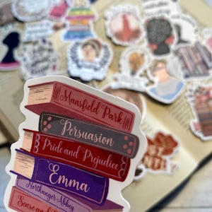May include: A stack of five colourful book stickers with the titles "Mansfield Park", "Persuasion", "Pride and Prejudice", "Emma", "Northanger Abbey", and "Sense and Sensibility".