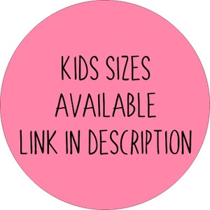 May include: Pink circle with the text "KIDS SIZES AVAILABLE LINK IN DESCRIPTION" in black.