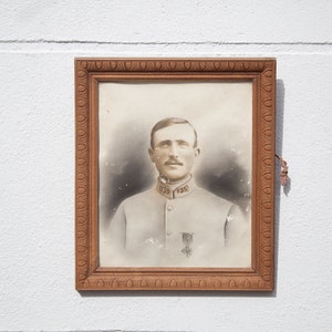Frame with military portrait, old wooden frame of a military man, wall decoration, frame