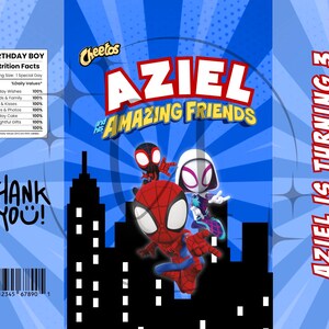 May include: A blue birthday-themed snack bag featuring Spider-Man and friends. The bag has the text "AZIEL and his AMAZING FRIENDS" and "AZIEL IS TURNING 3". Includes a "BIRTHDAY BOY" nutrition facts label and "THANK YOU!" text.