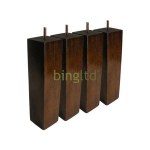 May include: Four dark brown wooden furniture legs with a square top and a beveled edge. Each leg has a metal screw at the top.