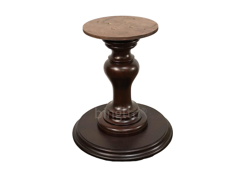 May include: A dark brown wooden table base with a round top and a pedestal base. The base has a fluted design and a smooth finish.