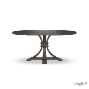 May include: A dark gray oval-shaped wooden dining table with a pedestal base. The table has a leaf that can be extended to increase the table's size.