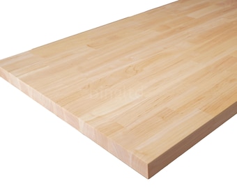 May include: A rectangular butcher block countertop made of light-colored wood. The wood grain is visible, and the surface is smooth. The countertop is likely for a kitchen or workspace.