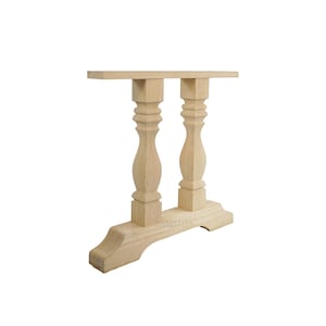 May include: Unfinished wood table base with two turned legs and a curved bottom. The base is made of solid wood and is ready to be stained or painted.