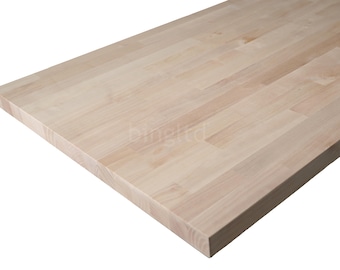 May include: Close-up of a light-colored wooden butcher block countertop. The wood grain is visible, and the surface is made of rectangular pieces of wood joined together. The countertop is rectangular and has a smooth, finished edge.