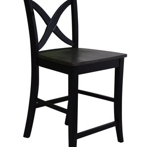 May include: Black wooden counter height chair with a criss-cross design on the back.