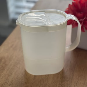Vintage clear 1 quart oval Tupperware container with lid
