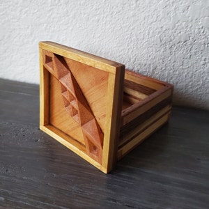 Wooden jewelry box with carving inside lid