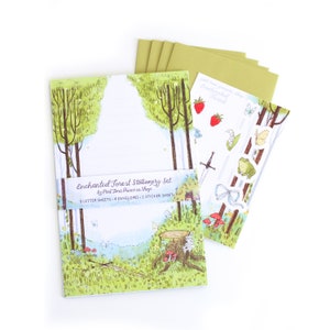 May include: Enchanted Forest Stationery Set by Part Time Princess Shop. The set includes 8 letter sheets, 4 envelopes, and 1 sticker sheet. The stationery features a whimsical forest scene with trees, mushrooms, and a frog.
