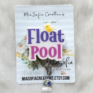 May include: A white badge reel with the words "Float Pool" in purple and pink, and a small yellow duck graphic. The reel also includes the text "MiaSofia Creations" and a website address.
