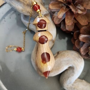 Dowsing pendulum made of chestnut wood and resin