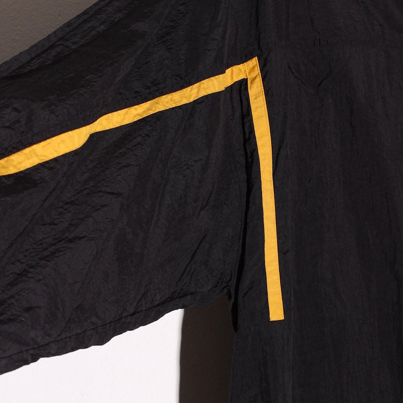 vintage 80s 90s windbreaker Reebok jacket black with pin stripes down sleeve and front oversized windbreaker track jacket 90s clothing