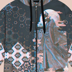 May include: A full-zip hoodie with a detailed illustration of a figure in traditional garb, set against a full moon. The design incorporates geometric patterns in shades of teal, brown, and pink. The hoodie features a black zipper and drawstring.