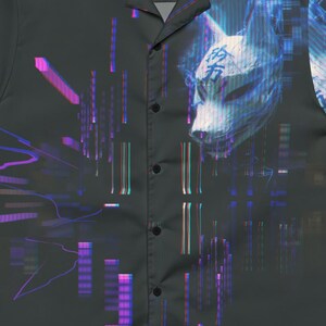 May include: Dark gray button-up shirt with a digital art design. The shirt features a stylized fox mask and geometric shapes in shades of blue, purple, and pink. The text "OKAMI.EXE BY KACIX" is printed on the collar.