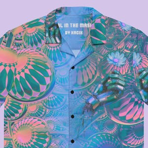May include: Short-sleeved button-down shirt with a vibrant, abstract design in shades of teal, pink, and blue. The shirt features a repeating pattern of geometric shapes and the text "AL IN THE MASK BY HACIK" on the collar.