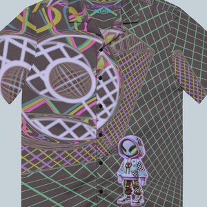 May include: A short-sleeved button-up shirt with a colourful geometric pattern. The pattern features a large circle with a grid design and a smaller figure in the bottom right corner. The shirt has a collar and a button-up front.