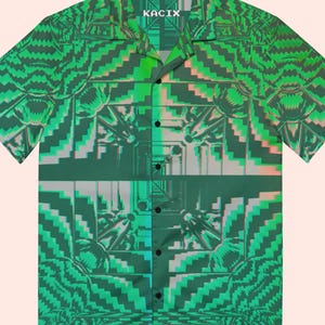 May include: Green button-up shirt with a geometric design. The shirt features a repeating pattern of abstract shapes in shades of green, with accents of pink and white. The brand name "KACIX" is visible on the collar.