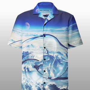 May include: A blue and white short-sleeved button-down shirt with a graphic print of clouds and a moon. The shirt has the text "Space Station 91" on the collar.