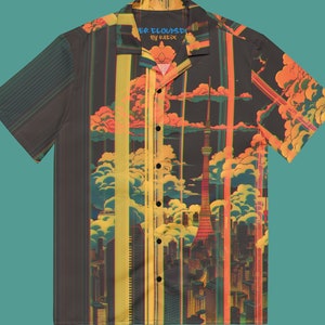 May include: A black and yellow short-sleeved button-up shirt with a cityscape and clouds print. The shirt has a collar and a pocket on the left side. The text "OVER CLOUDS BY KAIX" is printed on the pocket.