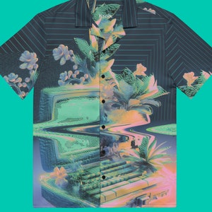 May include: A blue and black short-sleeved button-up shirt with a retro computer and floral design. The shirt has a pixelated effect and the text "Kaecx" on the collar.