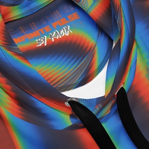 May include: A black hooded sweatshirt with a colourful abstract design and the text "INFINITE PULSE BY KACIX" on the inside of the hood.
