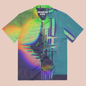May include: Short-sleeved button-down shirt with a vibrant, abstract design. The shirt features a split design with a gradient of colors, including green, yellow, blue, and purple. The text "solarpunk dustl by ljaciy" is printed on the collar.