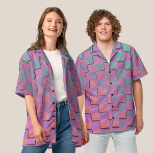May include: Two people wearing short-sleeved shirts with a pink, purple, and green checkered pattern. The shirts have a button-down collar and a button closure.
