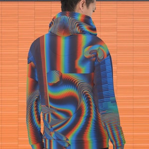 May include: A blue, red and yellow patterned hoodie with a drawstring hood. The hoodie has a pixelated and abstract design.
