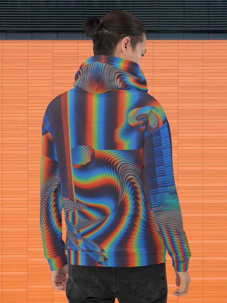 May include: A blue, red and yellow patterned hoodie with a drawstring hood. The hoodie has a pixelated and abstract design.