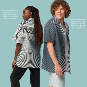 May include: Two models wearing short-sleeved button-down shirts with a black and white striped pattern. The shirt on the left has a swirling design, while the shirt on the right has a more geometric design. The model on the left is wearing size S and the model on the right is wearing size L.