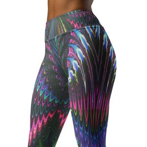 May include: High-waisted leggings with a vibrant, abstract design. The leggings feature a repeating pattern of colorful, wavy lines in shades of pink, blue, green, and purple against a black background. The fabric appears smooth and form-fitting.