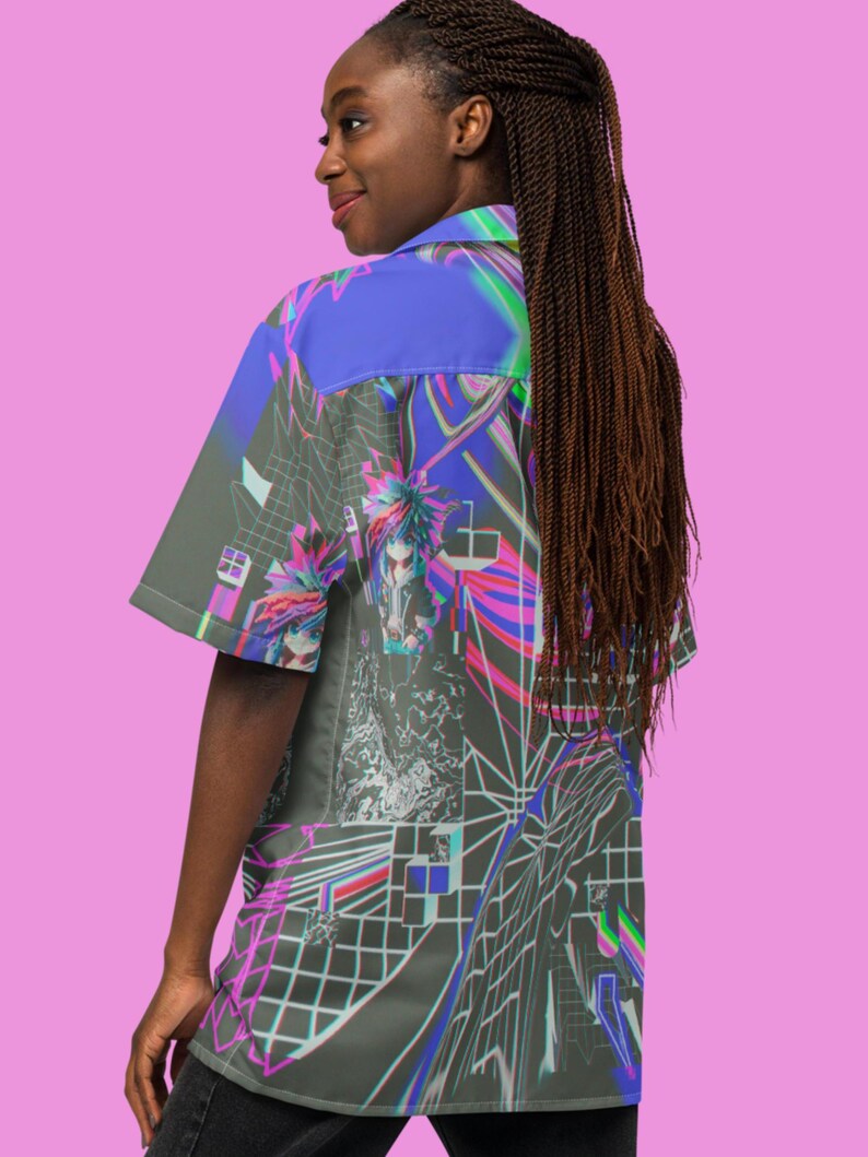 May include: A short-sleeved button-up shirt with a colorful, abstract print featuring geometric shapes and a glitch effect. The shirt is made of a lightweight fabric and has a relaxed fit.