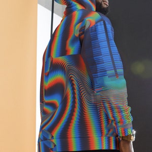 May include: A black hoodie with a colourful, abstract, pixelated design. The hoodie has a hood and a zip closure.