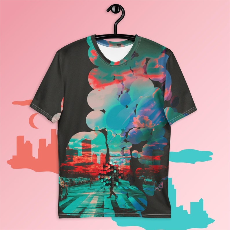 May include: A black t-shirt with a colorful abstract design featuring a cityscape, clouds, and circles. The design is a blend of blue, green, red, and pink.