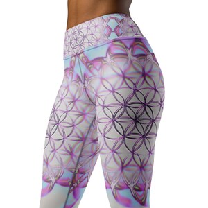 May include: High-waisted leggings with a repeating geometric pattern in shades of purple, pink, and white. The design features overlapping circles, creating a complex, symmetrical design. The leggings have a soft, iridescent sheen.