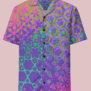 May include: Short-sleeved button-down shirt with a vibrant, psychedelic pattern. The shirt features a kaleidoscope of colors, including pink, green, purple, and yellow, creating a bold and eye-catching design. The collar has text that reads "Freefall Fringe By Hook".