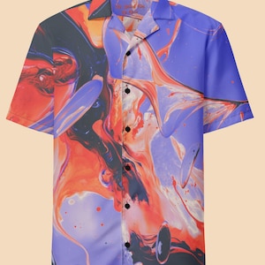 May include: A short-sleeved button-up shirt with a colorful abstract print. The print features swirls of orange, red, black, and white on a purple background.