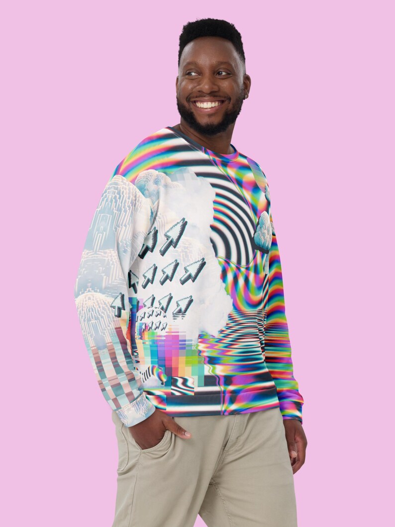 May include: A long-sleeved shirt with a colorful, abstract design featuring a pixelated pattern, clouds, and arrows. The shirt is made of a soft, comfortable fabric.