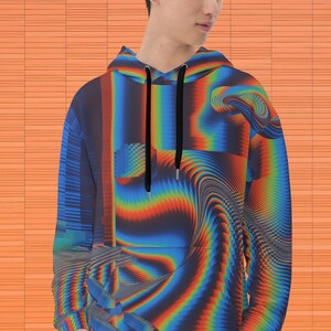 May include: A blue, red and orange abstract print hoodie with a black drawstring.