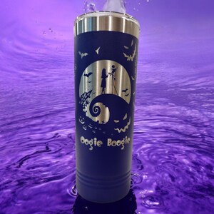 May include: A blue stainless steel tumbler with a laser-etched design of Jack Skellington and Sally from The Nightmare Before Christmas. The design includes the words "Oogie Boogie".