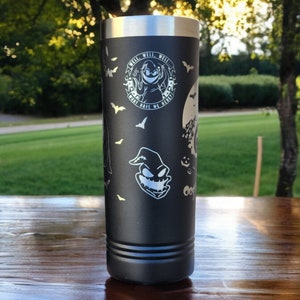 May include: Black stainless steel tumbler with a white design featuring a character from the movie "The Nightmare Before Christmas". The design includes the text "What's This?" and "This is Halloween".
