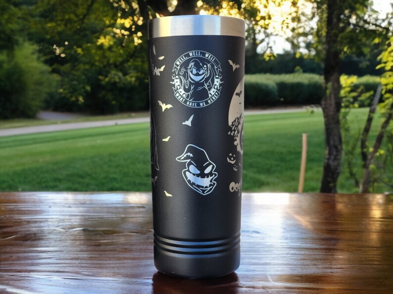 May include: Black stainless steel tumbler with a white design featuring a character from the movie "The Nightmare Before Christmas". The design includes the text "What's This?" and "This is Halloween".