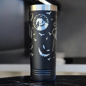 May include: Black stainless steel tumbler with a white design featuring bats, a moon, and the text "The Shadow on the Moon at Night".