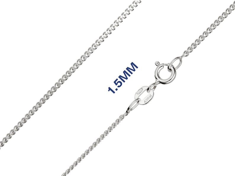 May include: A close-up of a silver curb chain necklace with a spring ring clasp. The chain is 1.5mm thick and has a shiny surface. The clasp is marked "ITALY".